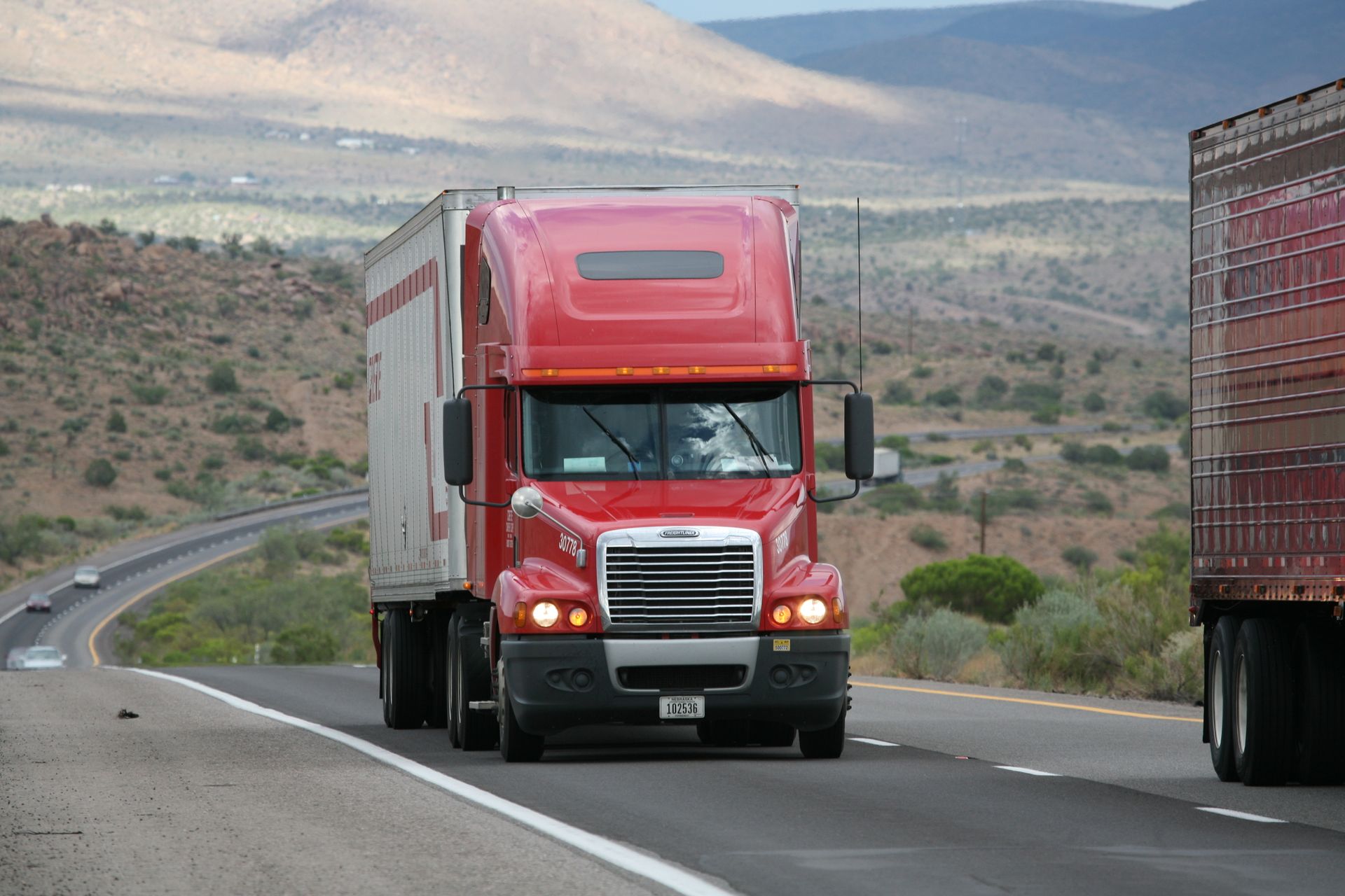 Tractor-trailer moving freight on a mountain highway
